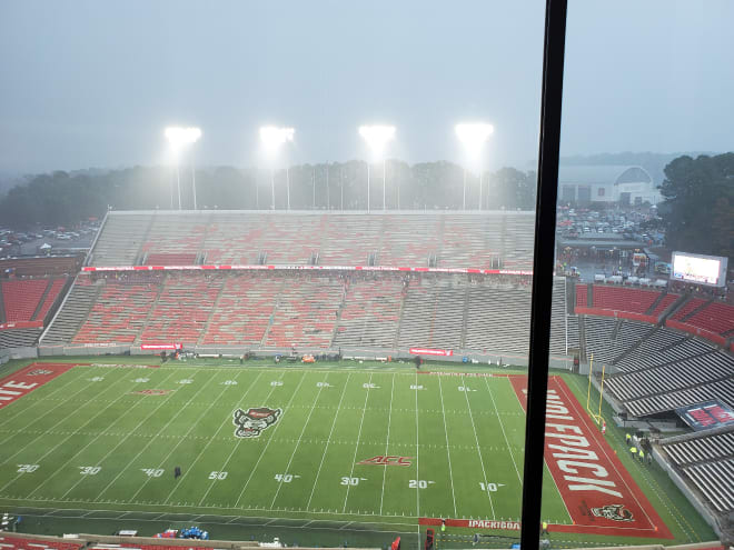 Fans began to exit Carter-Finley Stadium after play was suspended due to lightning in the area.