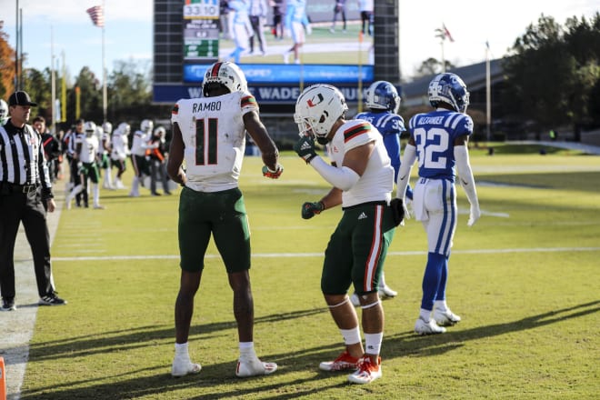 Miami's Charleston Rambo, left, and Xavier Restrepo celebrate one of Rambo's touchdowns against Duke on Saturday. 