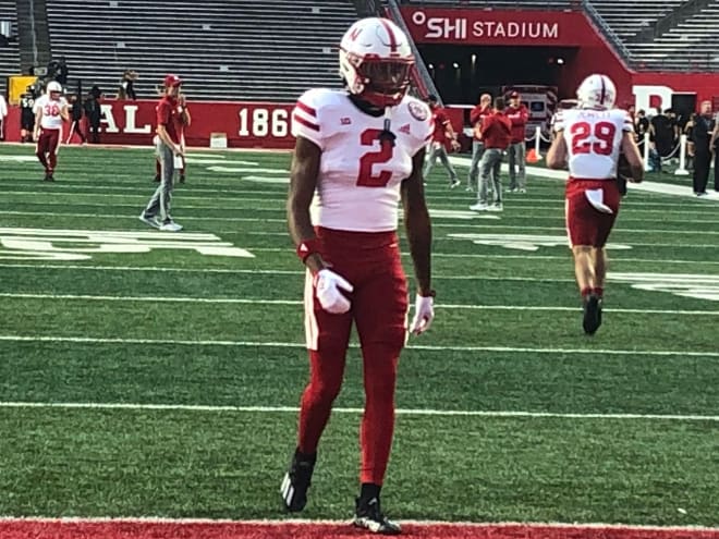 Tommi Hill wearing No. 2 while warming up with the receivers last Friday at Rutgers.
