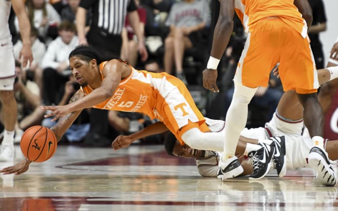 Mar 2, 2024; Tuscaloosa, Alabama, USA; Tennessee guard Zakai Zeigler (5) dives for a loose ball with Alabama guard Rylan Griffen (3) at Coleman Coliseum.