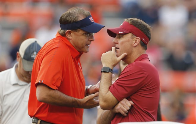 Gus Malzahn and former Arkansas head coach, new Auburn OC Chad Morris.