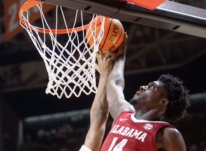 Alabama center Charles Bediako (14) goes for a dunk during a basketball game between the Tennessee Volunteers and the Alabama Crimson Tide held at Thompson-Boling Arena in Knoxville, Tenn. Photo | Brianna Paciorka/News Sentinel / USA TODAY NETWORK