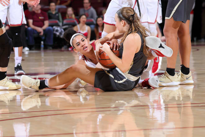 Kaylee Johnson fights for a loose ball against Colorado.