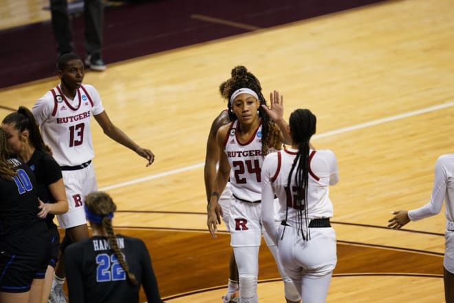 Rutgers' Arella Guirantes high-fives teammate Sakima Walker