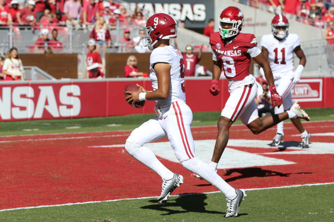 Alabama Crimson Tide quarterback Bryce Young (9) rushes for a touchdown in the first quarter against the Arkansas Razorbacks at Donald W. Reynolds Razorback Stadium. Photo | Nelson Chenault-USA TODAY Sports