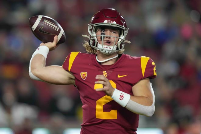 Former Southern California Trojans quarterback Jaxson Dart (2) throws the ball against the BYU Cougars in the first half at United Airlines Field at Los Angeles Memorial Coliseum. Dart transferred to Ole Miss earlier this week. Mandatory Credit: Kirby Lee-USA TODAY Sports