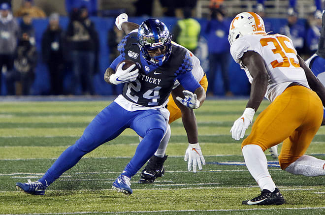 Kentucky's Lynn Bowden Jr. stands on the field after leading his