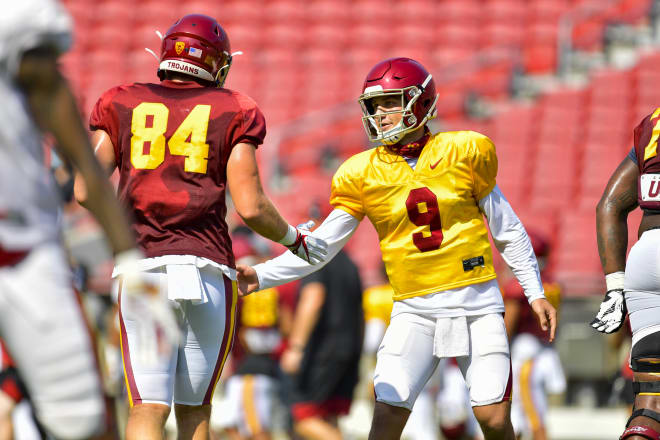 Quarterback Kedon Slovis and tight end Erik Krommenhoek on Saturday during USC's first preseason scrimmage inside the Coliseum.