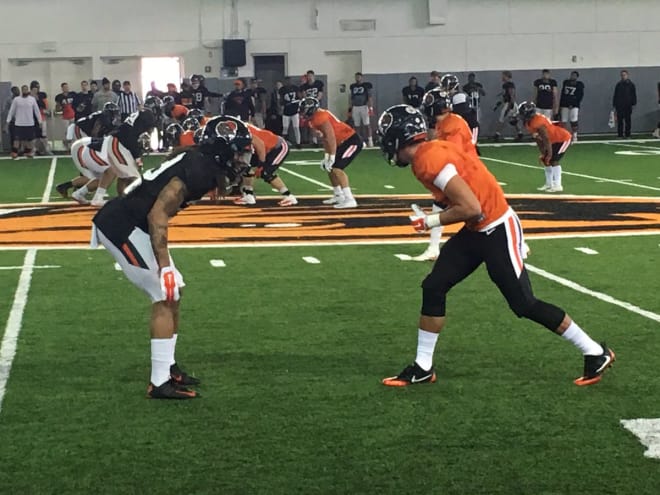 Christian Wallace matching up with Isaiah Hodgins during spring practice