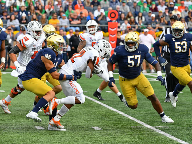 Alohi Gilman (left) and Jayson Ademilola (57) helped keep the Bowling Green offense in check.