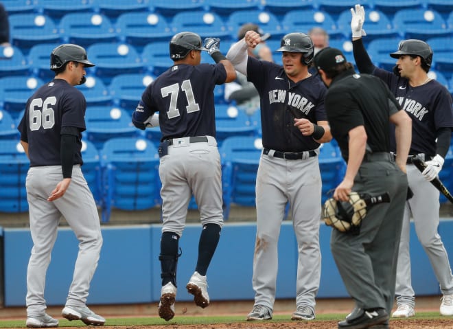 New York Yankees first baseman Luke Voit (59) (R) greats shortstop Thairo Estrada (71) (L) after hitting a home run in the third inning during spring training at TD Ballpark. Mandatory Credit: Nathan Ray Seebeck-USA TODAY Sports