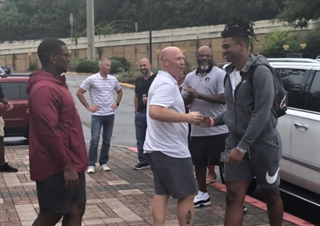 Rivals100 DE Marvin Jones Jr. is greeted by FSU defensive coordinator Adam Fuller and the Seminoles' other coaches when he arrived for Day 2 of his visit Saturday.