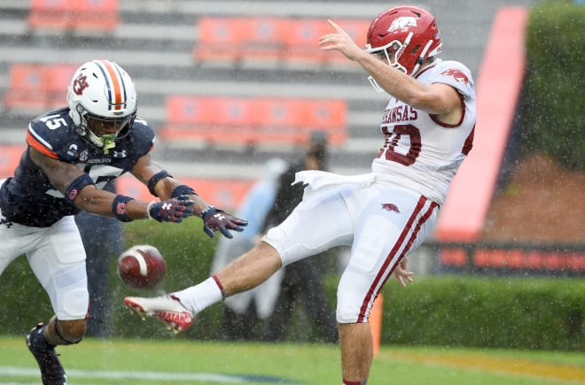 George Caratan had two punts blocked in his three games with the Razorbacks.