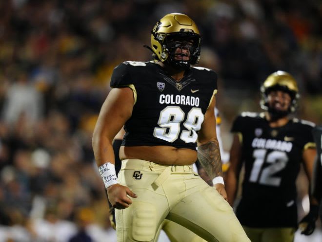 Defensive tackle Jalen Sami celebrates 