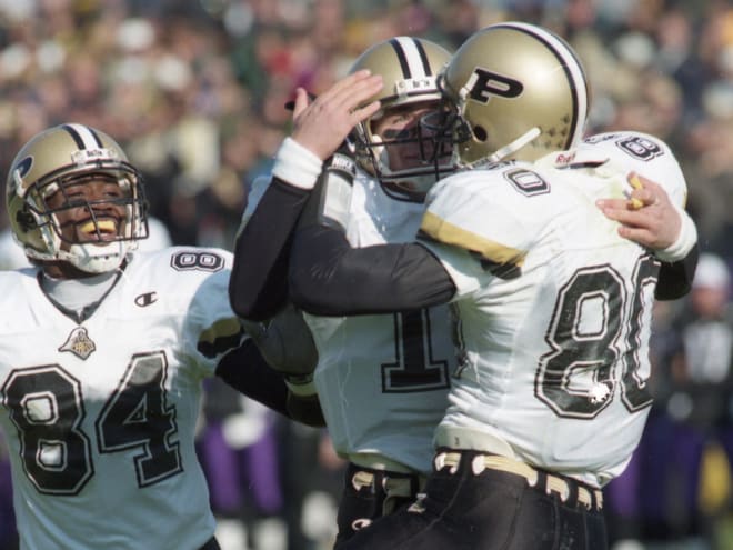 Simpson (90) shown here celebrating with Drew Brees his first TD reception of his career, one of six scoring aerials that day for Brees. 