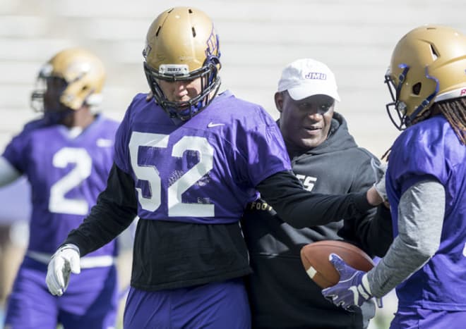 Inside linebackers coach Warren Belin (middle) is one of three first-year assistants that will earn more than their predecessors.