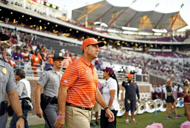 Clemson head coach Dabo Swinney is shown here Saturday night entering Doak Campbell Stadium.  Swinney tied legendary Oklahoma head coach Barry Switzer on the all-time wins list (157) following his team's 34-28 victory over Florida State.