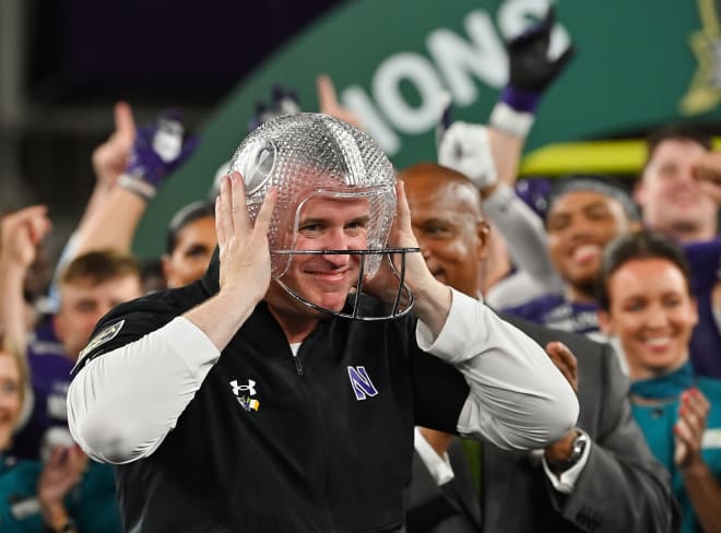 Northwestern coach Pat Fitzgerald celebrates after his team beat Nebraska in the opener. 