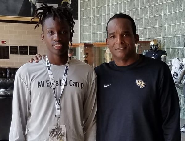 Quadric Bullard posts with UCF defensive coordinator Randy Shannon during a March unofficial visit.