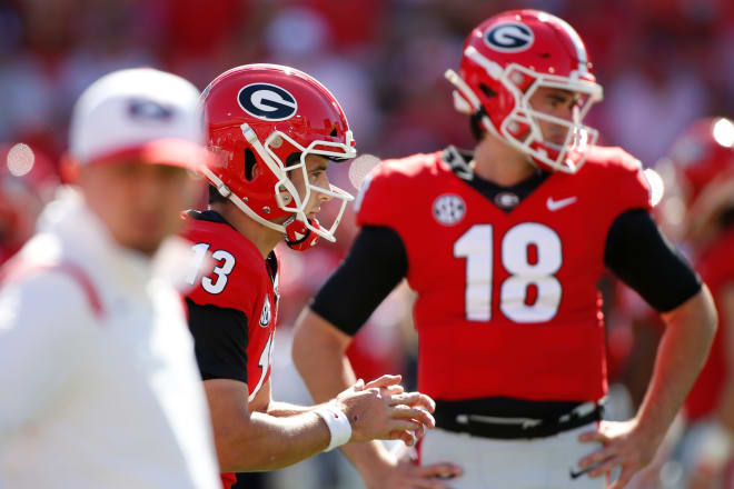 Georgia quarterback Stetson Bennett (13) warms up while Georgia quarterback JT Daniels (18) looks on before an NCAA college football game between Kentucky and Georgia in Athens, Ga. Photo | USA TODAY