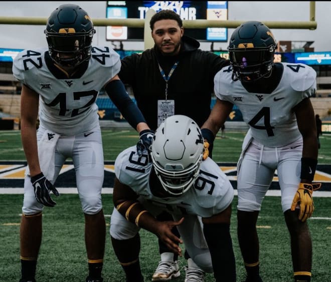 Gillespie (center) was impressed with his junior day stop to see West Virginia Mountaineers football. 