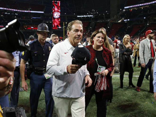Alabama Crimson Tide head coach Nick Saban and his wife Terry leave the field following the SEC championship game after defeating the Georgia Bulldogs at Mercedes-Benz Stadium. Alabama won 41-24. Photo | Gary Cosby Jr.-USA TODAY Sports