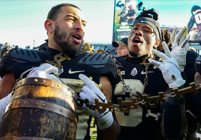 Nov 25, 2023; West Lafayette, Indiana, USA; Purdue Boilermakers running back Devin Mockobee (45) and Purdue Boilermakers running back Tyrone Tracy Jr. (3) celebrate with the Old Oaken Bucket after the game at Ross-Ade Stadium. Mandatory Credit: Robert Goddin-USA TODAY Sports