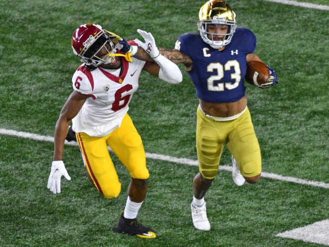 Former Notre Dame running back Kyren Williams stiff arms USC cornerback Isaac Taylor-Stuart in last season's 31-16 Irish victory.