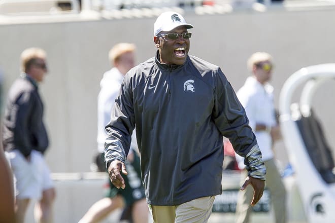 Co-defensive coordinator Harlon Barnett is having a blast coaching, a hungry, enthusiastic, and rapidly improving Michigan State defense.