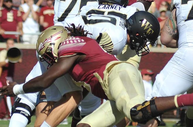 Josh Sweat with a sack in the first half.