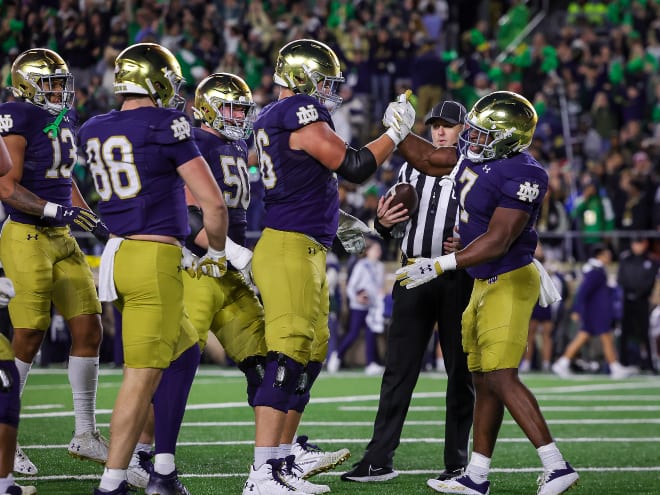 Notre Dame running back Audric Estime, right, and left tackle Joe Alt, next in to the left, have been invited to the 2024 NFL Scouting Combine.