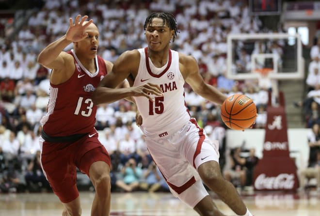 Arkansas forward Jordan Walsh (13) guards Alabama forward Noah Clowney (15) as he drives into the lane at Coleman Coliseum. Photo | Gary Cosby Jr.-Tuscaloosa News / USA TODAY NETWORK