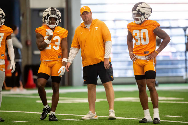 Tennessee head coach Josh Heupel with defensive backs Boo Carter (23) and Jakobe Thomas (30) during UT's first spring football practice on Monday, March 18, 2024.