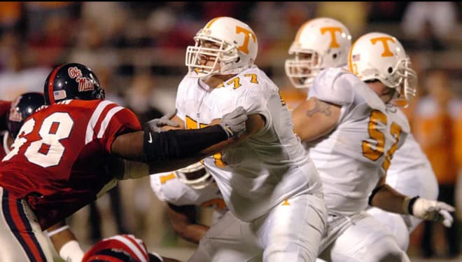 Tennessee’s Michael Munoz (77) blocks Ole Miss’ McKinley Boykin (68) away from Tennessee quarterback Erik Ainge during third quarter action on Oct. 16, 2004. 