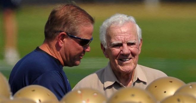 Brian Kelly and Ara Parseghian share a moment prior to a practice several years ago.