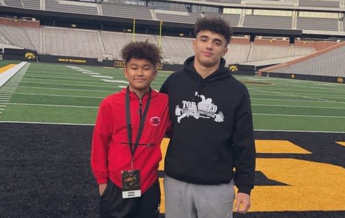 Arland Bruce IV (right) and his little brother on their visit to Iowa City Saturday.