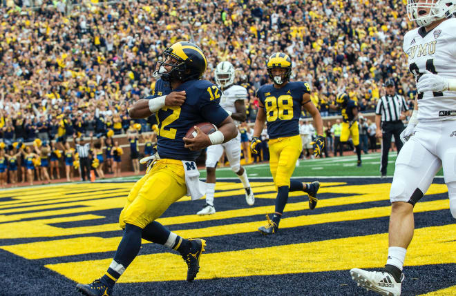 Michigan Wolverines football fifth-year senior RB Chris Evans is glad to be back with his team.
