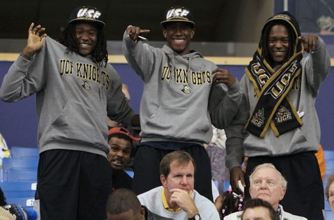 As seniors in high school, Shaquem Griffin (left), his brother Shaquill (right) and USF WR Rodney Adams (center) attended UCF's 2012 bowl game, the Beef 'O' Brady's Bowl in St. Petersburg.