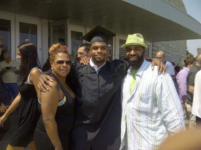 Ricks with his mother, Robin Bell, and his father, Graddie