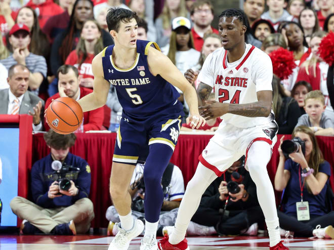 Notre Dame grad senior Cormac Ryan dribbles against NC State's Ernest Ross during another ACC loss for the Irish.