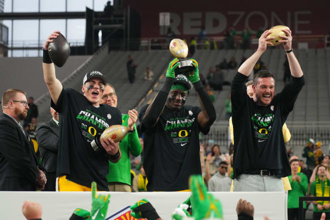The Ducks celebrate their Fiesta Bowl win over Liberty on Monday.