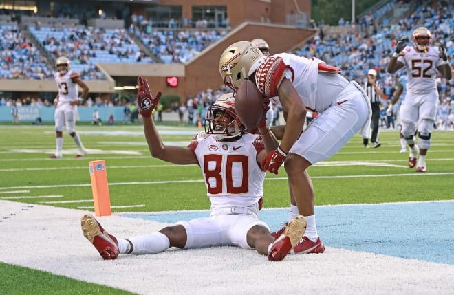 Ontaria Wilson signals 'touchdown' following his catch in the end zone against North Carolina on Saturday.