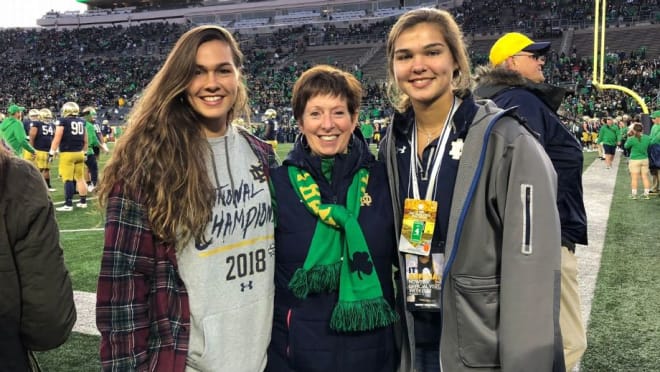 Maddie and Kathryn Westbeld with Muffet McGraw at a Notre Dame football game