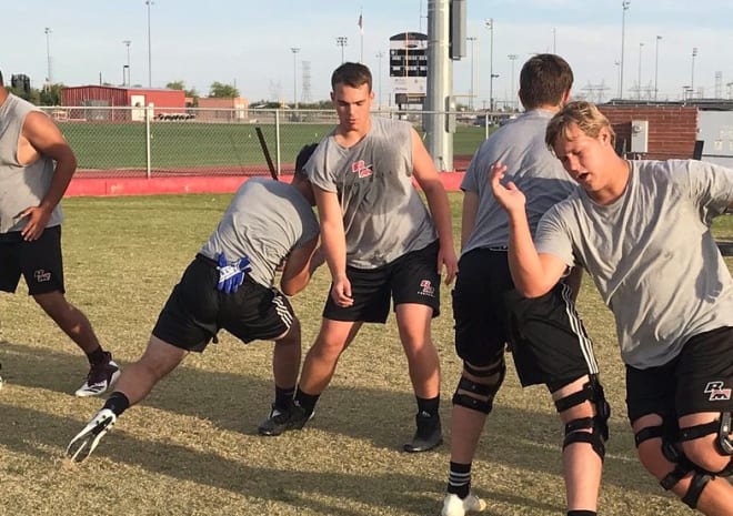 Red Mountain OL Ben Bray (center) at a recent practice