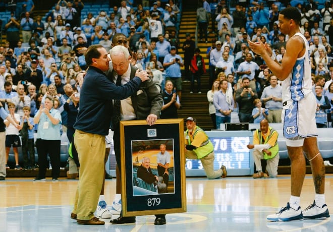 Willaims is congratulated by Scott Smith, the son of UNC legendary coach Dean Smith.