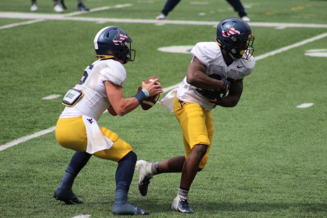 Garrett Greene (left) will likely open the 2021 season as QB2 for the West Virginia football team.