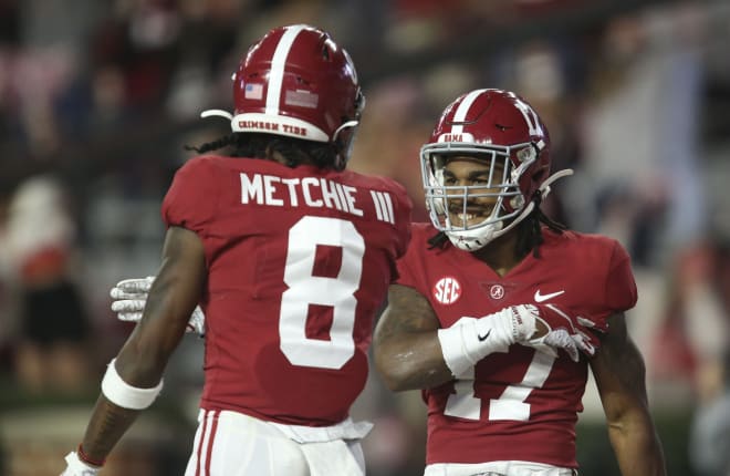 Alabama wide receiver John Metchie III (8) and Alabama wide receiver Jaylen Waddle (17) celebrate Waddle's 90 yard touchdown during the second half of Alabama's 41-24 win over Georgia at Bryant-Denny Stadium. 