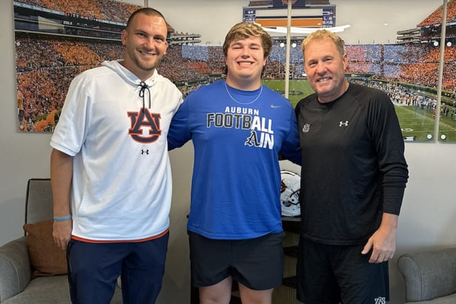 Auburn special teams coordinator Tanner Burns with Buckner and Hugh Freeze.