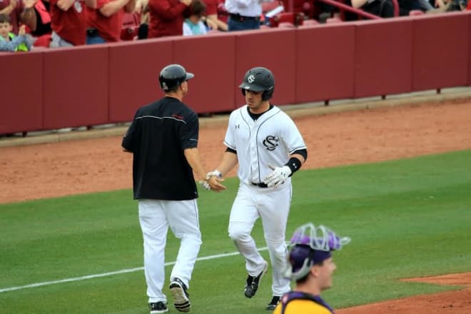 John Jones is congratulated after belting a homer in Saturday's game  