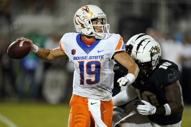 Boise State quarterback Hank Bachmeier (19) throws a pass as he is pressured by Central Florida linebacker Eriq Gilyard (10) during the first half of an NCAA college football game Thursday, Sept. 2, 2021, in Orlando, Fla. (AP Photo/John Raoux)